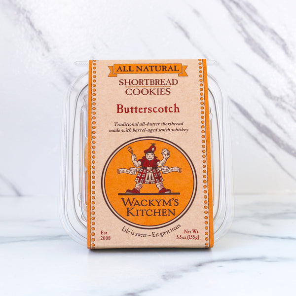 Packaging of Wackym's Kitchen butterscotch shortbread cookies on a marble surface.