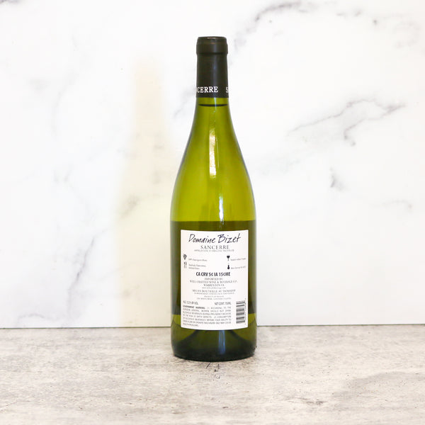 Wine bottle of Domaine Bizet Sancerre Blanc with label on a marble surface