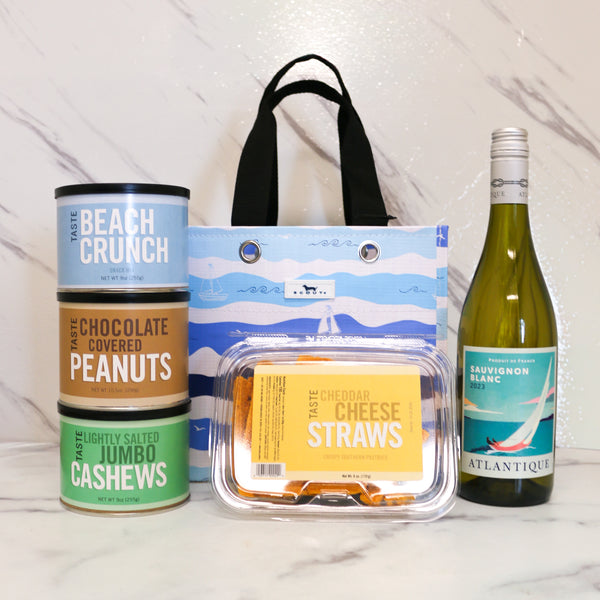 TASTE's Sail into Summer Gift in a blue Scout bag with Wine and Snacks