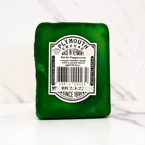 Green Plymouth Cheese bar with label on a white background