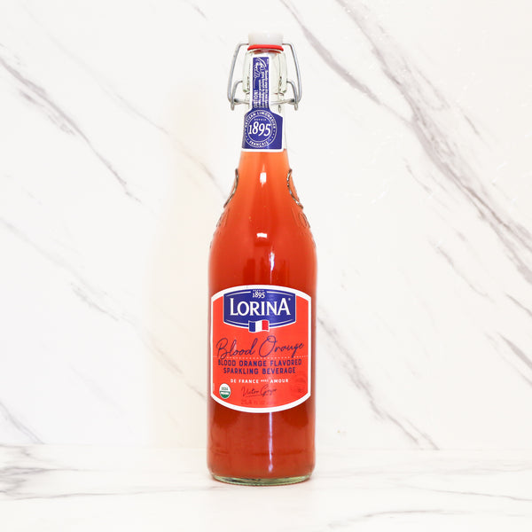 a bottle of Lorina blood orange sparkling beverage on a marble background.