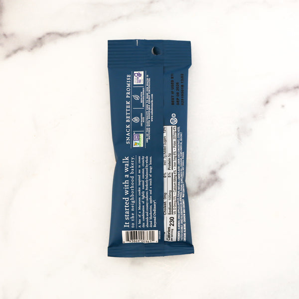 Blue snack bar package on a marble surface