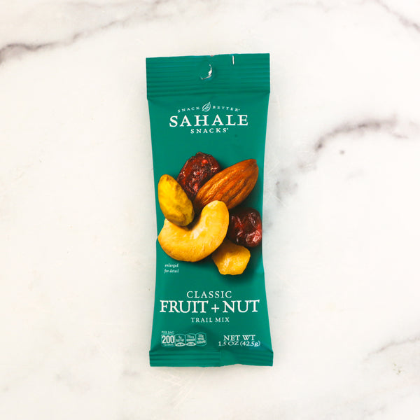 Sahale Snacks Classic Fruit + Nut trail mix package on a marble surface