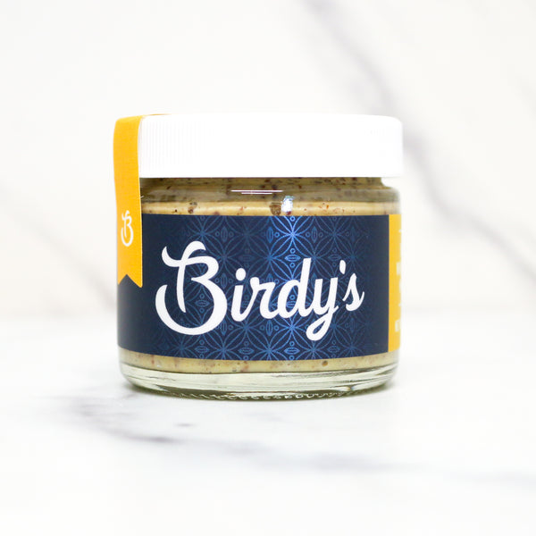 Jar of 'Birdy's' with a blue label and yellow tag on a white background