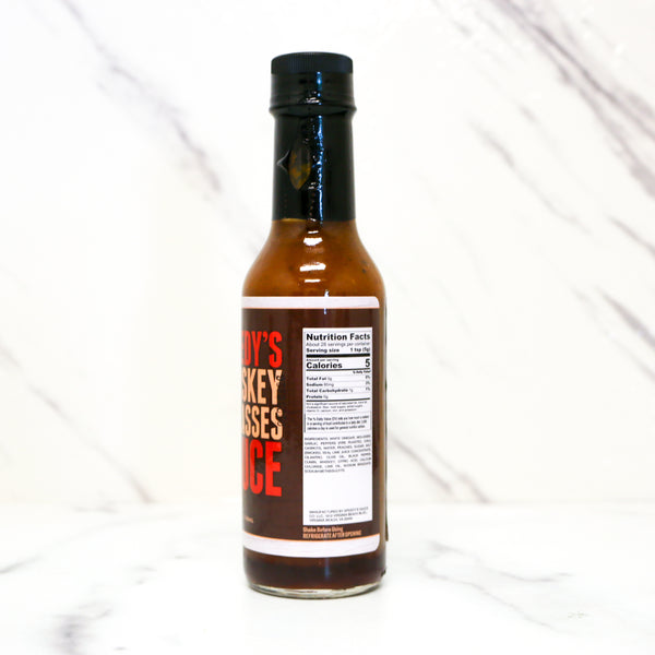 Bottle of hot sauce with a label on a white background