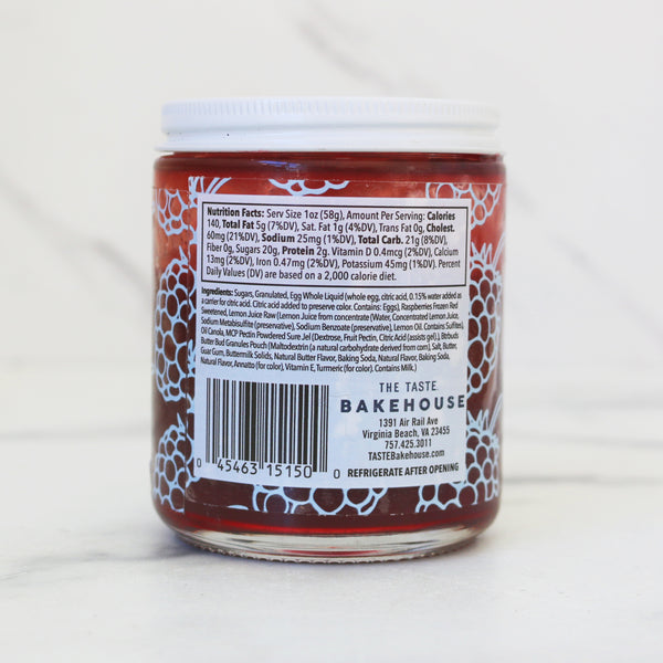 Back label of a TASTE Bakehouse raspberry jar with text and a barcode on a white background