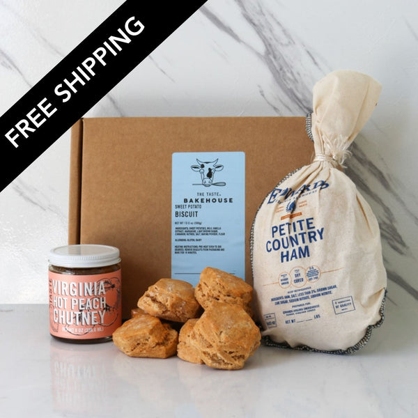 The definitive Virginia meal kit. Includes the classic paring of Edwards Petite Country Ham, with TASTE Backhouse mad Sweet Potato Biscuits, and TASTE's own, Virginia Hot Peach Chutney.  very Assorted food items including biscuits, chutney, and ham in a box with 'Free Shipping' text. 