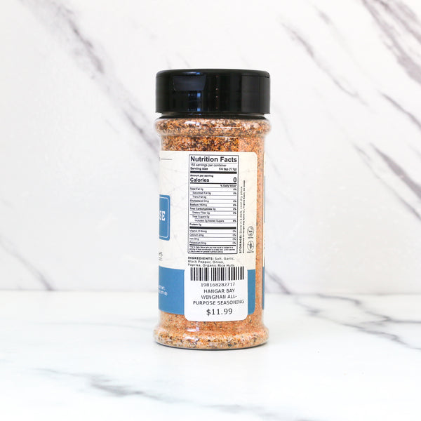 Spice jar labeled 'All-Purpose Wingman', showing Nutrition facts on a white marble background