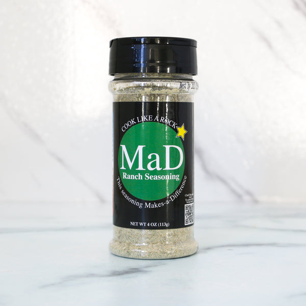 MaD Ranch Seasoning container on a white marble background.  jar with label on a white background. All MaD Seasonings come from Matt Starcher, aka The MattDad, aka @themattdad, a culinary pro, instructor and contestant on Next Level Chef with Gordon Ramsay (Season 5). That chef-driven pedigree shows in every blend