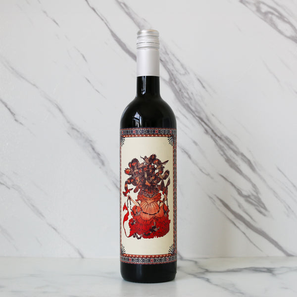 Wine bottle with decorative label on a marble background