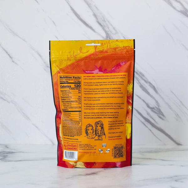 Stellar Snacks French Dijon pretzels packaging with nutrition facts on a marble surface