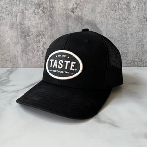 TASTE Trucker Hat –  The Good Life, est. 1973 logo (Black)