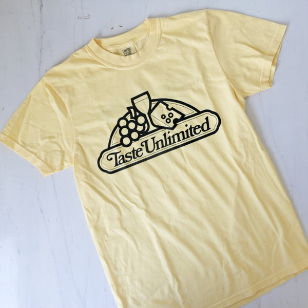 a yellow t-shirt with the classic TASTE logo