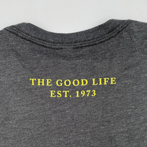 Gray TASTE t-shirt back with 'The Good Life Est. 1973' text in yellow high in the center of the back, between shoulder blades, on charcoal heather background