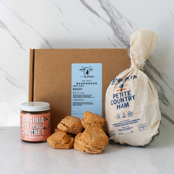 TASTE Sweet Potato Biscuits with Edwards Virginia Ham Kit: The definitive Virginia meal kit. Includes the classic paring of Edwards Petite Country Ham, with TASTE Backhouse mad Sweet Potato Biscuits, and TASTE's own, Virginia Hot Peach Chutney.  very Assorted food items including biscuits, chutney, and ham in a box with 'Free Shipping' text. 