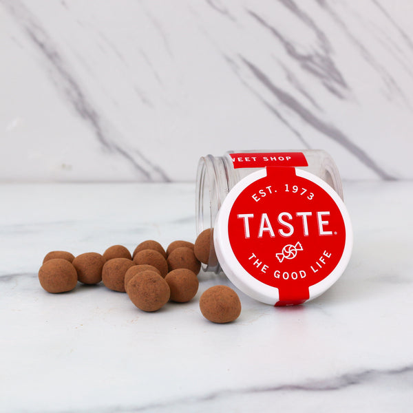 Jar of 'Taste the Good Life' treats on a marble surface