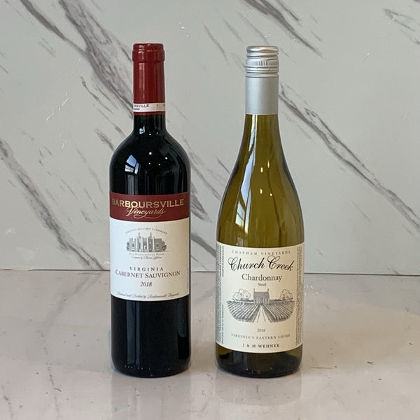 Two bottles of wine, one red and one white, with labels indicating they are from Virginia. The red wine is bottled under the name 'Barboursville' and the white wine under the name 'Church Creek'.