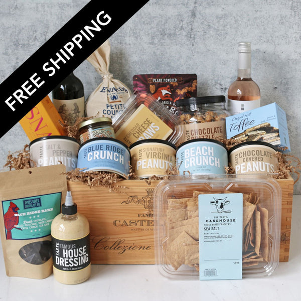 Gourmet gift basket with various food items on a gray surface, featuring free shipping text.