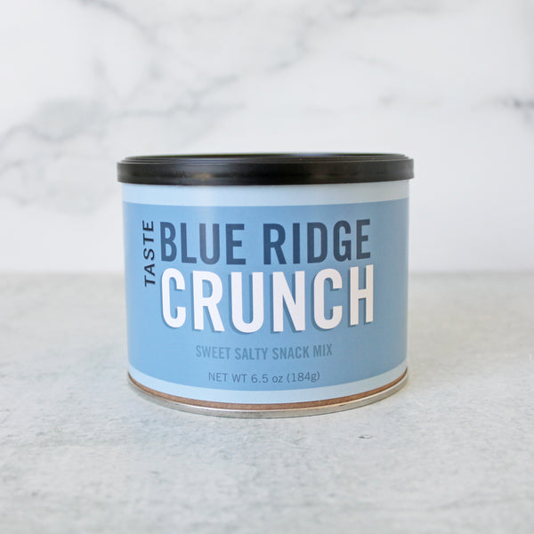 A can of TASTE Blue Ridge Crunch sweet salty snack mix, with pretzels, oat cereal, graham cereal