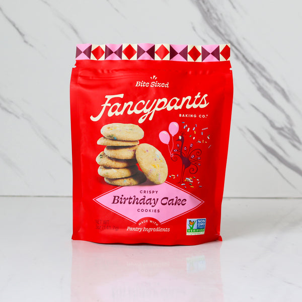 Red package of Fancypants Crispy Birthday Cake cookies on a white background