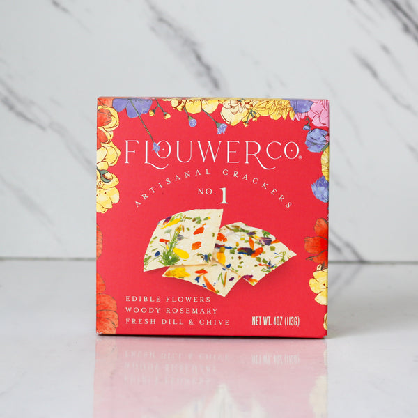 Flower co artisanal crackers packaging on a gray marble background