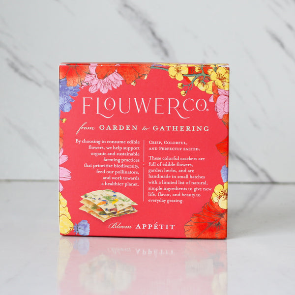 Flower Co. packaging with floral design on a gray background