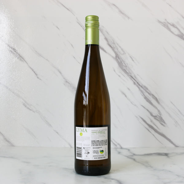 Wine bottle with green cap on a marble surface