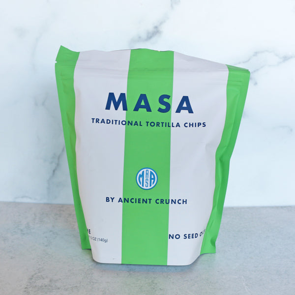 Bag of MASA traditional tortilla chips on a marble surface