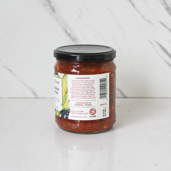 A jar of New Canaan Farms Black Bean & Corn Salsa showing ingredients 