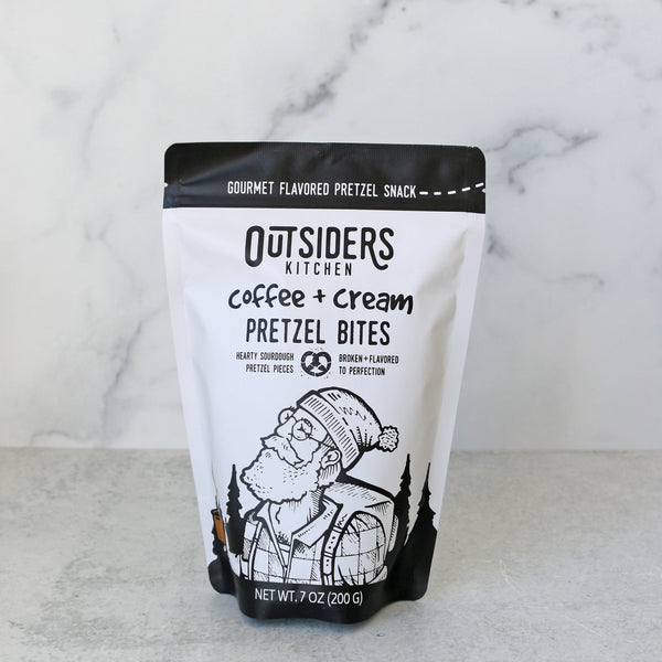 A package of Outsiders Kitchen Coffee & Cream Pretzel Bites against a marble background.