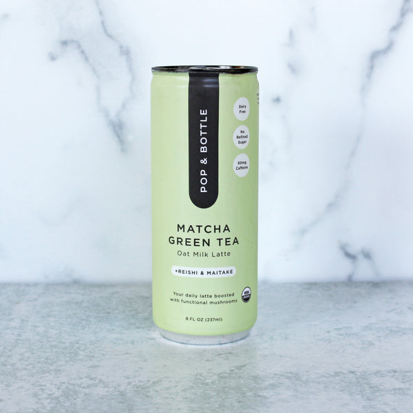 A can of Pop & Bottle Oat Milk Latte in Matcha Green Tea flavor. The can is green with black text and accents.