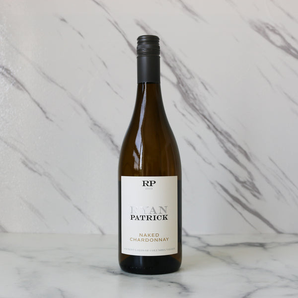Wine bottle labeled 'RP Ryan Patrick Naked Chardonnay' on a marble background