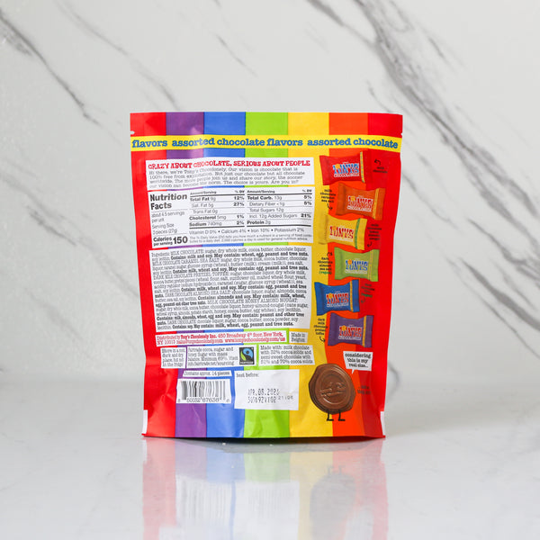 Assorted chocolate bag with rainbow label on a white background showing Nutrition Facts and other info