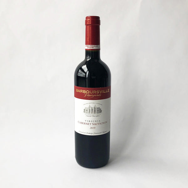 A bottle of 2017 Barboursville Cabernet Sauvignon wine with a red cap, labeled with the brand and vintage, on a white background.