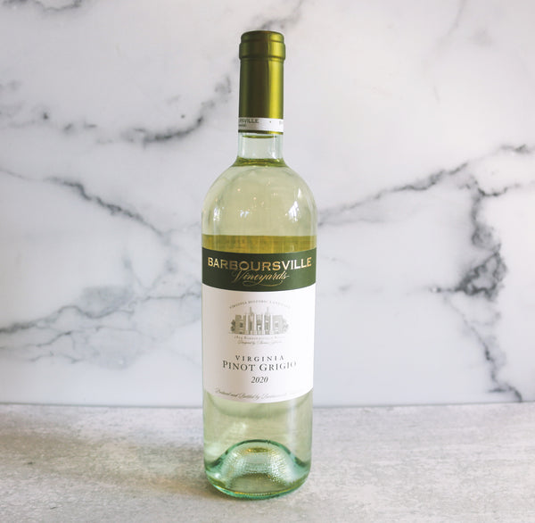 A bottle of Barboursville Pinot Grigio 2002 wine positioned in front of a marble background.