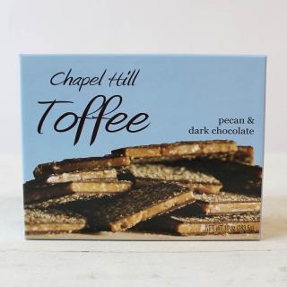 A box of Chapel Hill Toffee featuring pecan and dark chocolate flavors. The packaging is blue with an image of the toffee squares on the front.