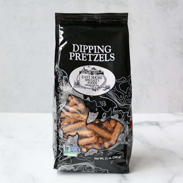 A bag of East Shore Dipping Pretzels against a light background, with the bag displaying the product name and a picture of the pretzels.