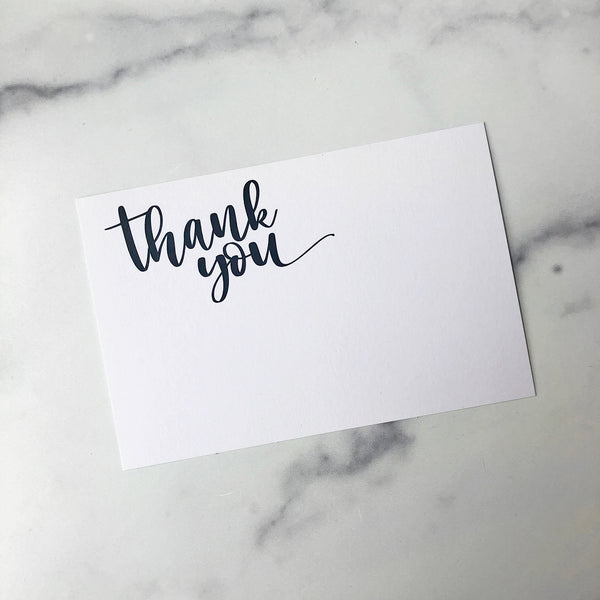 A gift enclosure card with the text 'Thank You'