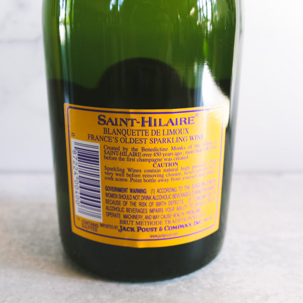 A Bottle of Saint-Hilaire, Blanquette De Limoux Blanc De Blanc shown on a white marble background
