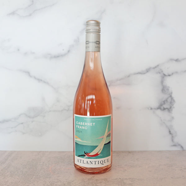 A bottle of pale pink rosé wine labeled 'Cabernet Franc France 2011' from the brand Atlantique.