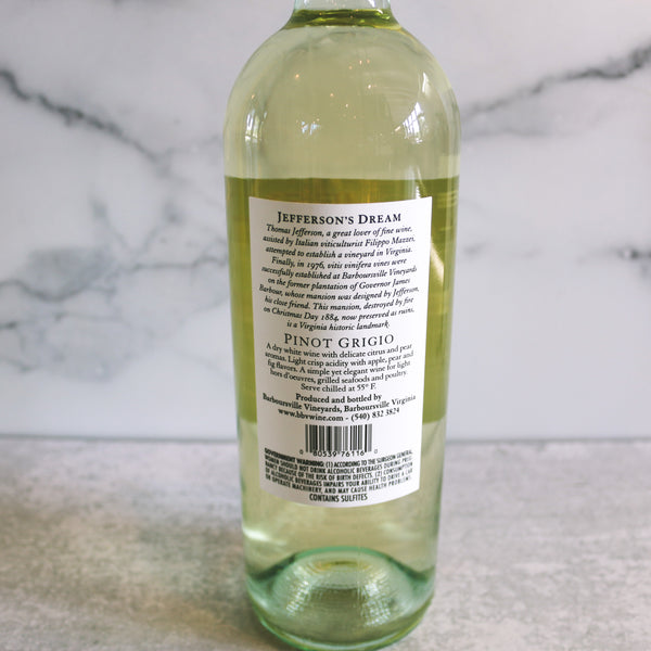 The back of a bottle of Barboursville Pinot Grigio 2002 wine positioned in front of a marble background.