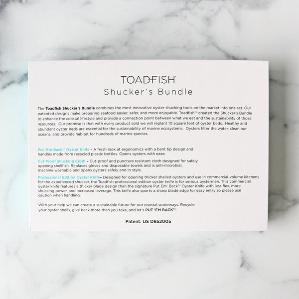 The image shows a set of oyster shucking tools within a  box 