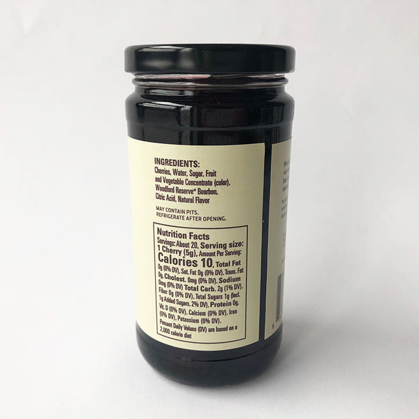 A jar of Woodford Reserve Bourbon Cherries with a label that includes the ingredients and nutrition facts
